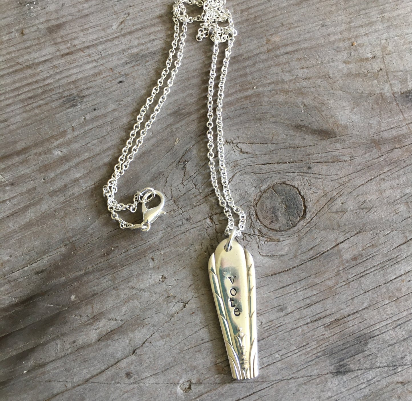 Handcrafted VOTE bar necklace hand-stamped on upcycled vintage silverplate with engraved urn and flourishing foliage design, eco-friendly jewelry