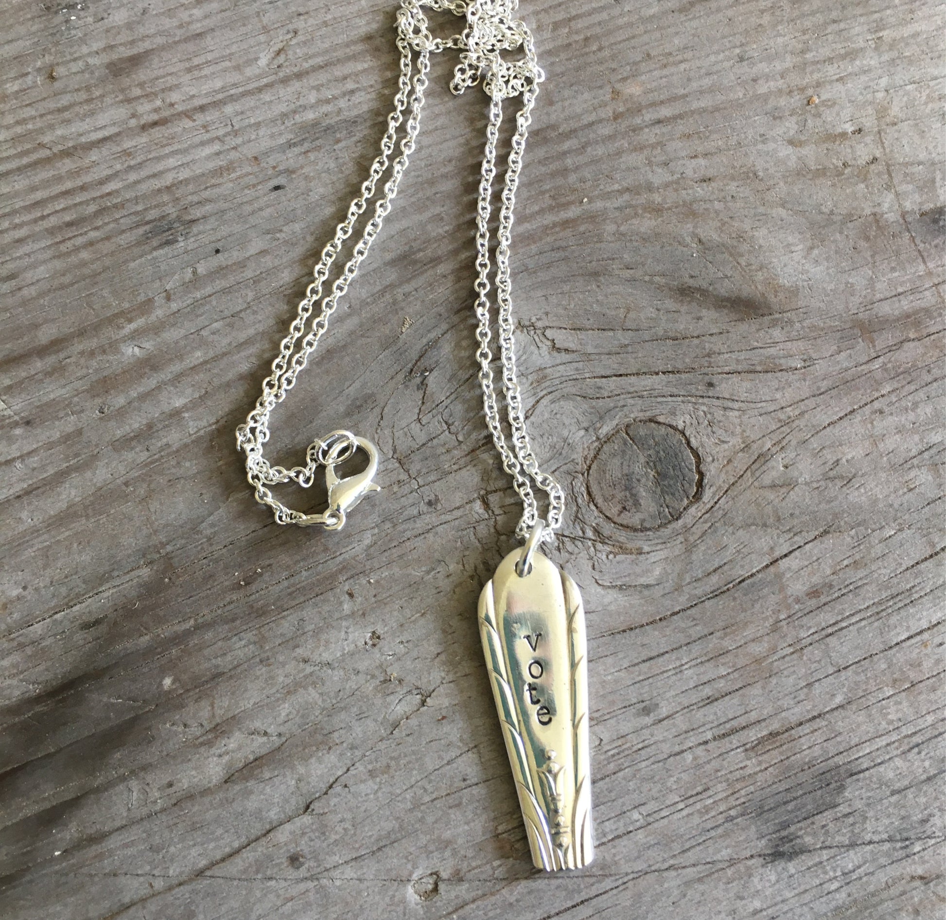 Handcrafted VOTE bar necklace hand-stamped on upcycled vintage silverplate with engraved urn and flourishing foliage design, eco-friendly jewelry