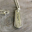 Close-up detail of VOTE bar pendant showing hand-stamped lettering on vintage 1922 Homestead pattern silverware, meaningful design