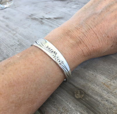 Handmade Spoon Bracelet Stamped BADASS shown on model