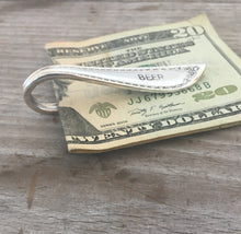 Side view of spoon money clip