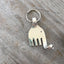 Close-up detail of silverplate fork elephant keychain showing hand-shaped design and polished finish, 2.25 inches long