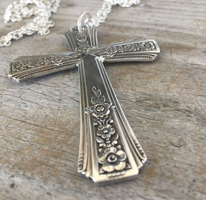 Detailed view of Cross necklace made from upcycled vintage silverplate spoon handles