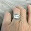 Hand stamped WANDER spoon ring worn on finger displaying size and fit of upcycled silverware ring