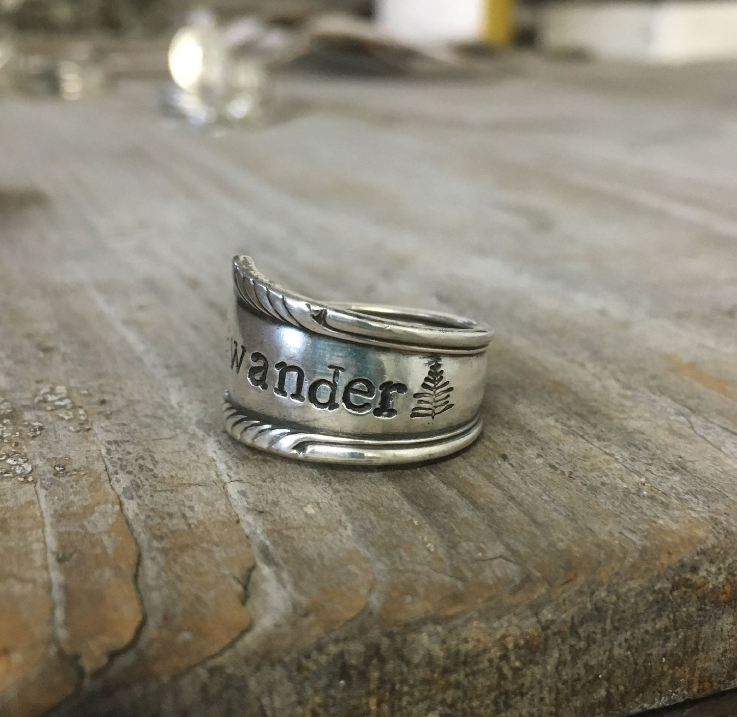 Close-up of WANDER pattern spoon ring showing vintage silverware detail and craftsmanship