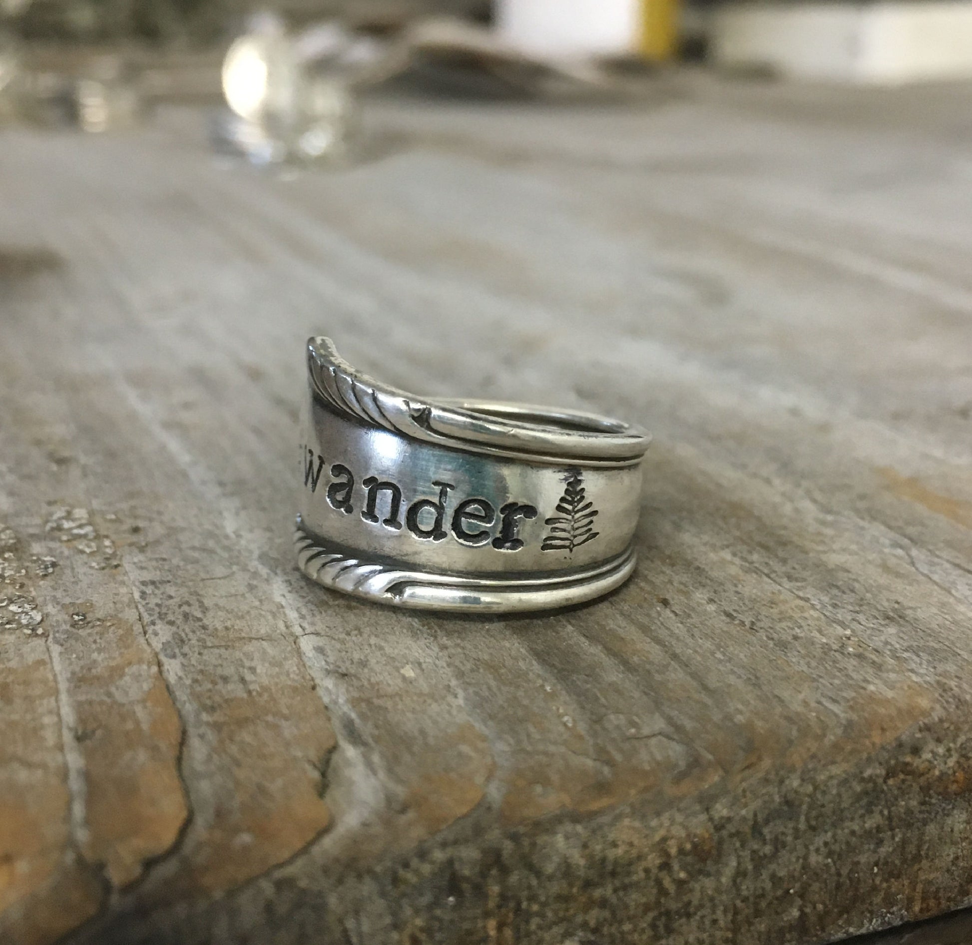 Close-up of WANDER pattern spoon ring showing vintage silverware detail and craftsmanship