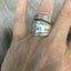 Wander mountain spoon ring shown on hand - handcrafted artisan silverware jewelry