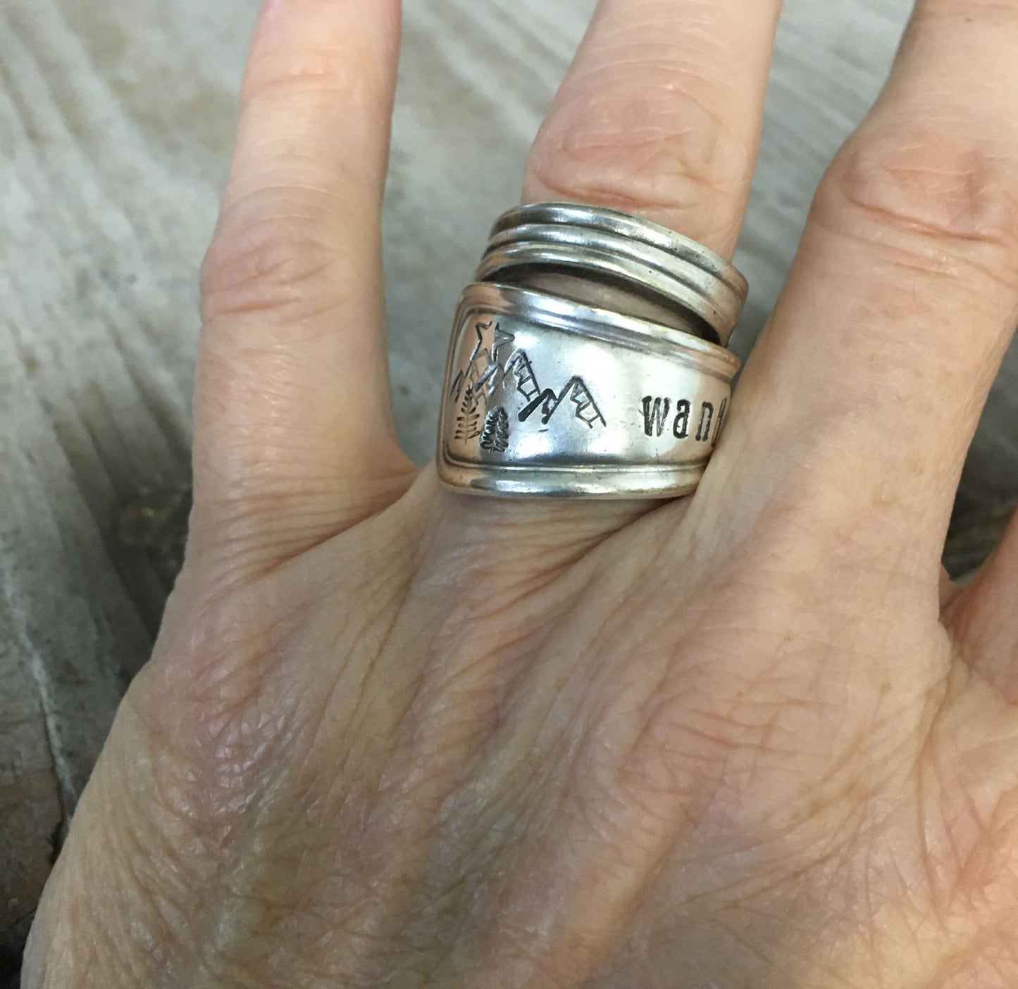 Wander mountain spoon ring shown on hand - handcrafted artisan silverware jewelry