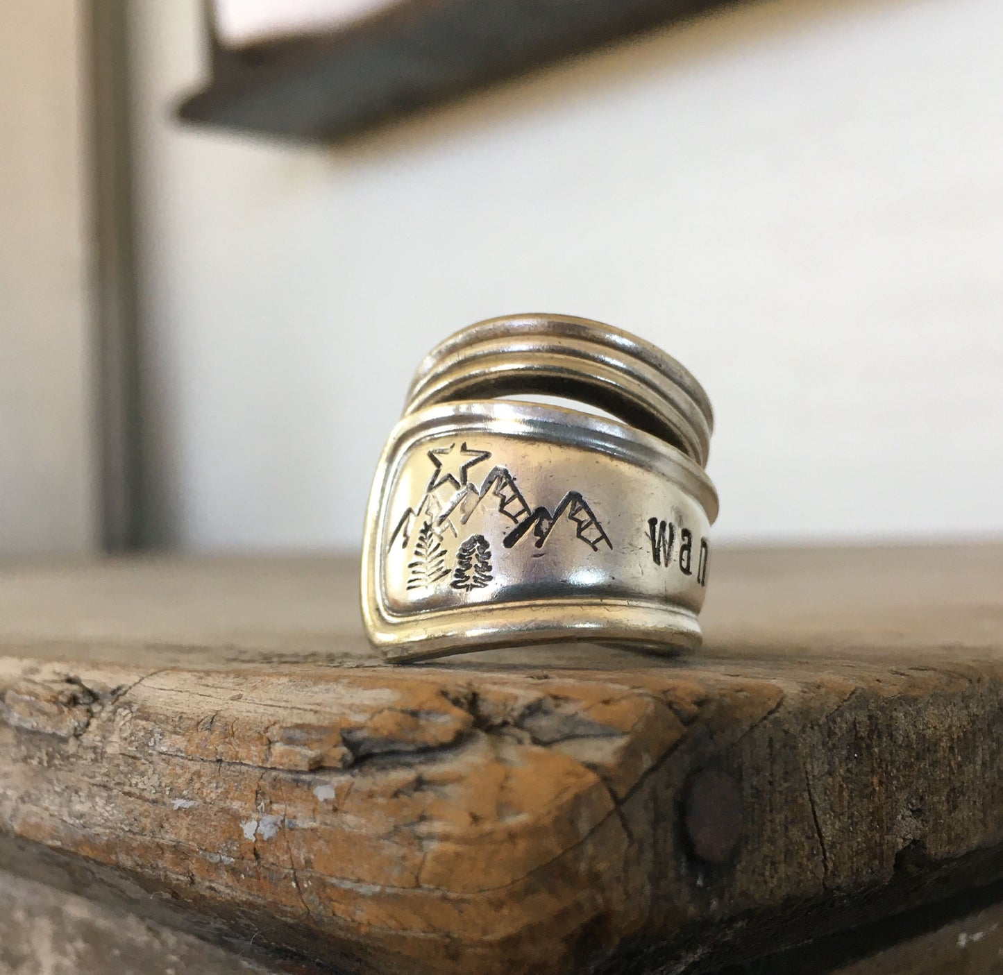 Close up of stamped scene on Wander mountain spoon ring s- handcrafted artisan silverware jewelry