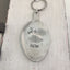 Close-up of But First Coffee hand-stamped spoon keychain showing vintage silverware detail and lettering