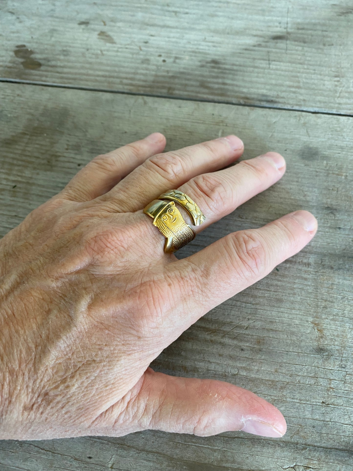 Upcycled Spoon Ring of figural Mr. Peanut shown on model