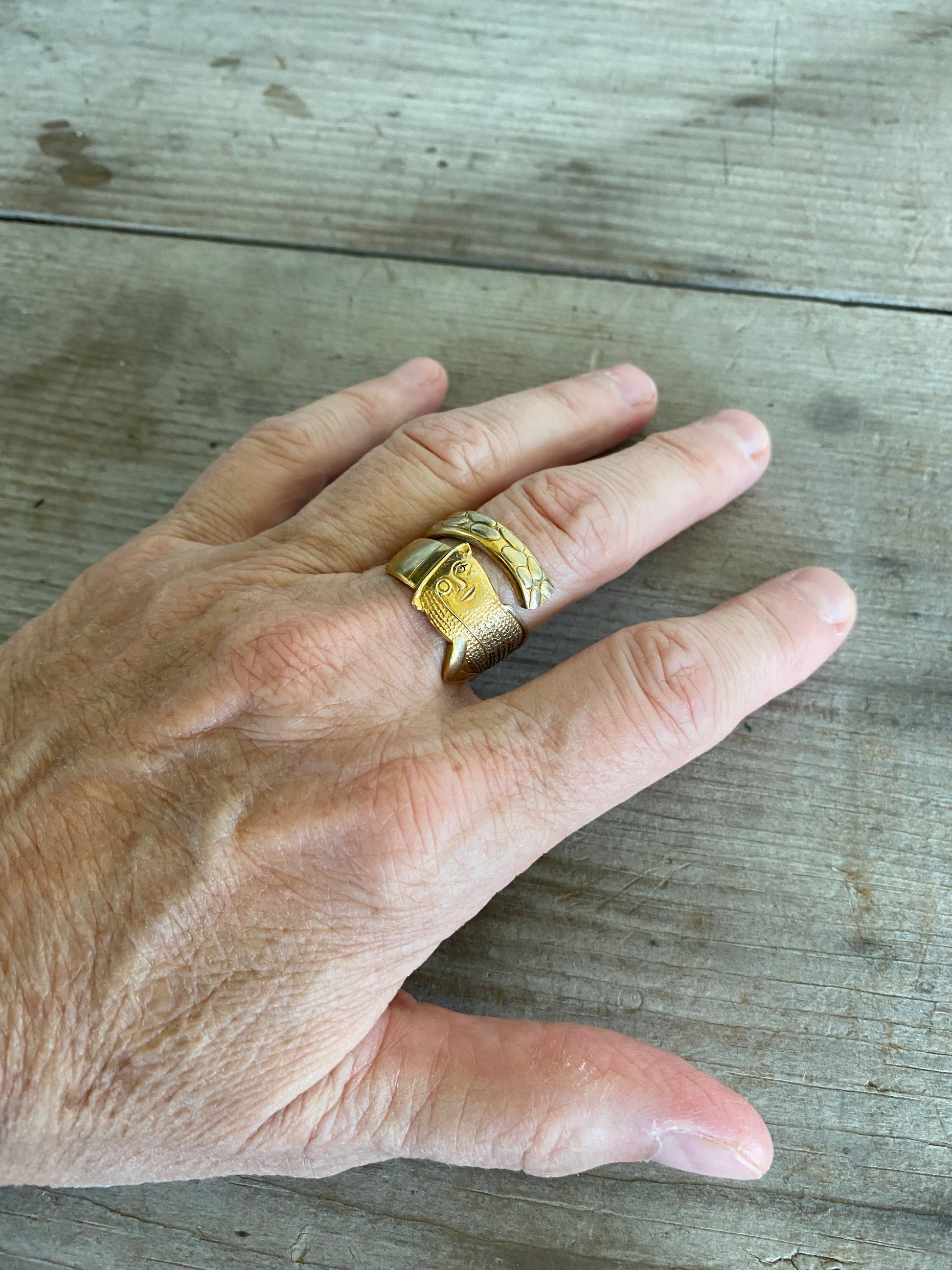 Upcycled Spoon Ring of figural Mr. Peanut shown on model