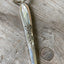 Upcycled vintage silverware spoon handle keychain alternate view showing handcrafted pattern details
