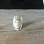 Close-up of Sage Women of Nature hand-stamped spoon ring - upcycled vintage silverware
