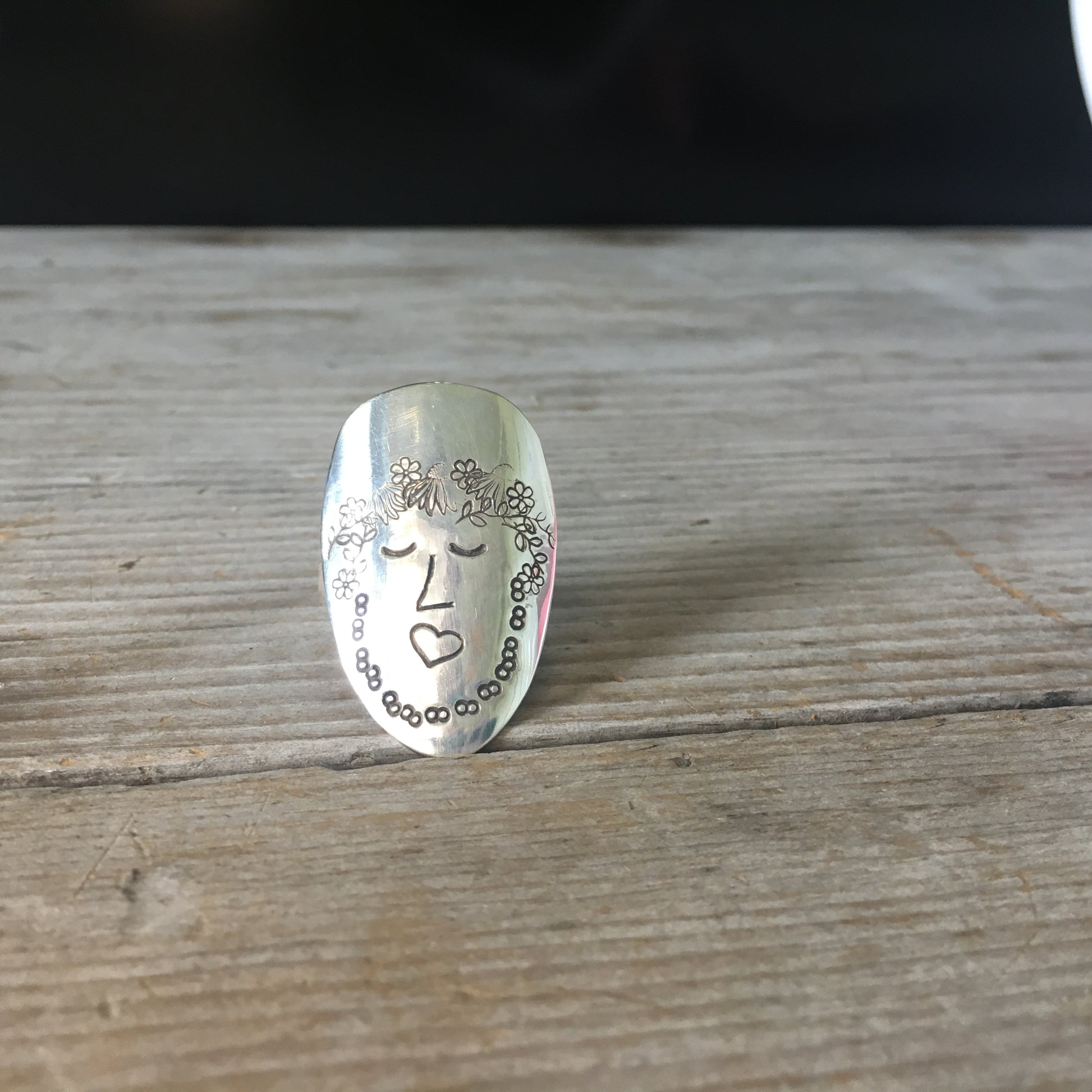Close-up of Sage Women of Nature hand-stamped spoon ring - upcycled vintage silverware