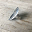Side view of Women of Nature Sage spoon ring showing hand-stamped woman's face and flower shank detail