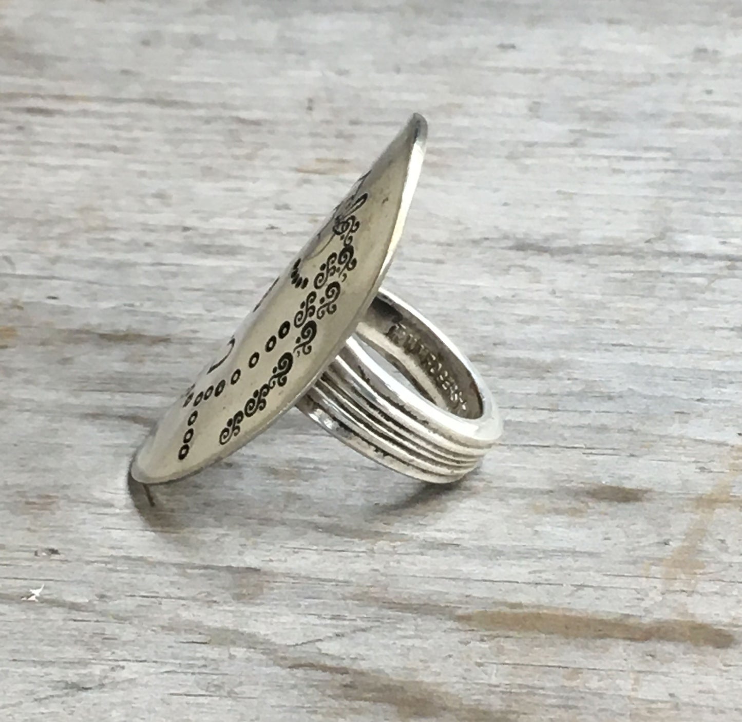 Side view of hand-stamped Tula statement ring - nature-inspired vintage silverware jewelry