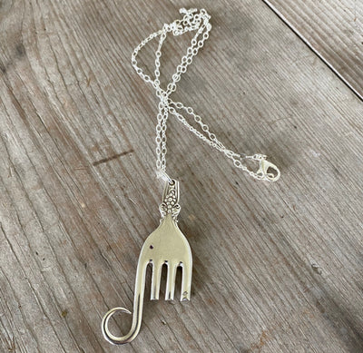 Wide view of elephant necklace and chain 