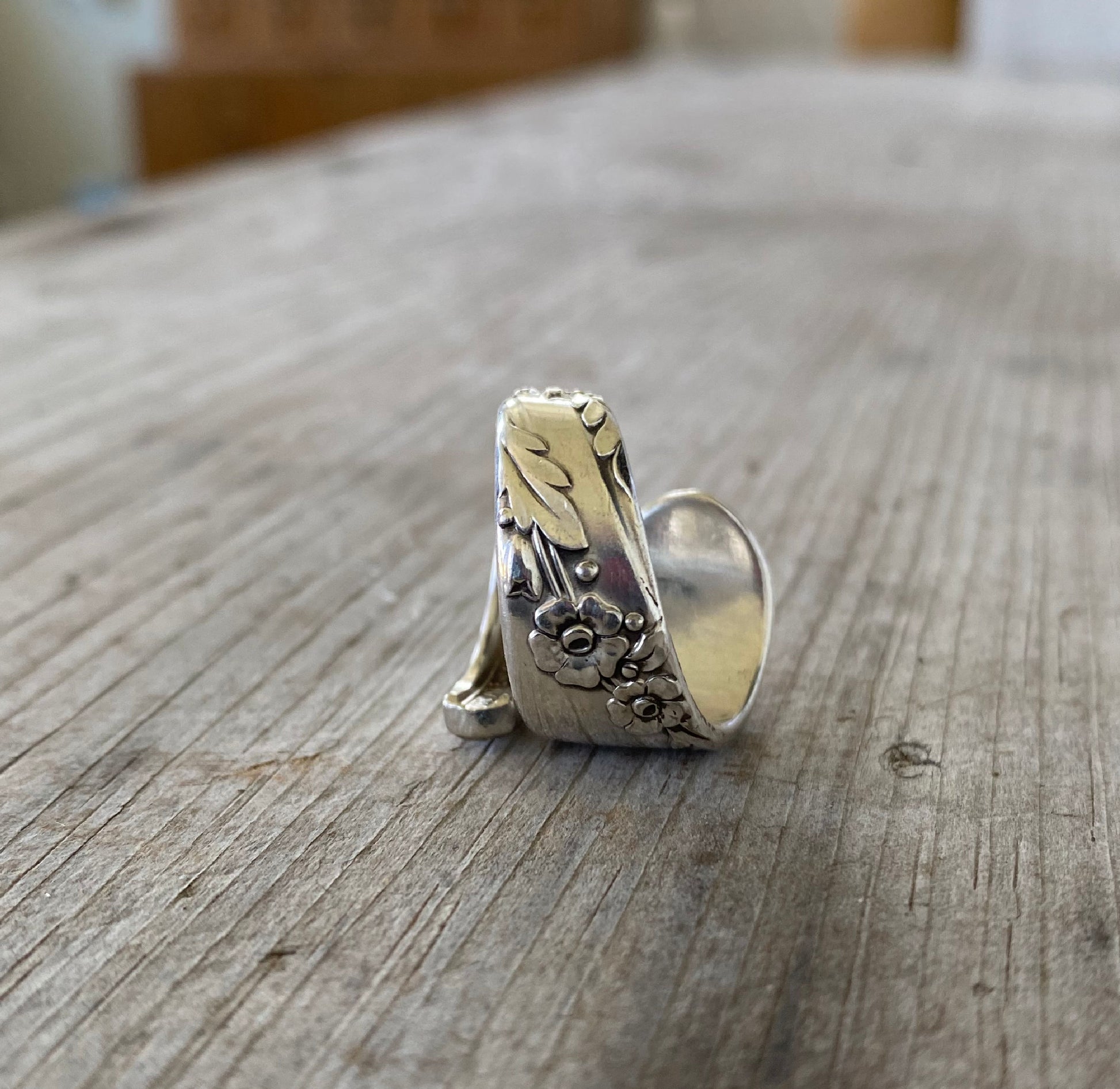 Detailed view of floral design on bridal wreath spoon ring