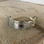 Ornate detail of Spread Love Handstamped Antique Butter Knife Bracelet