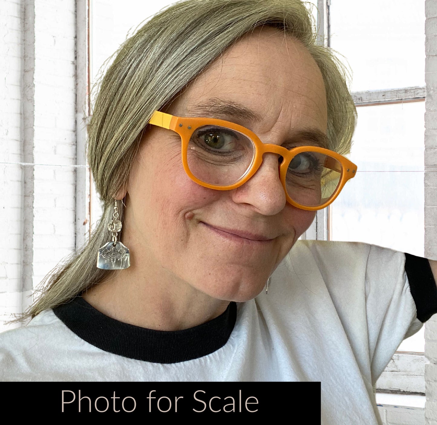 Fork earrings shown on human for scale