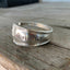 Hand-stamped spoon cuff bracelet from International Silver Cromwell pattern with DO EPIC SHIT message and historic hotel silver