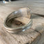 Close-up detail of internal Hotel Nicollet stamping on interior of spoon cuff bracelet