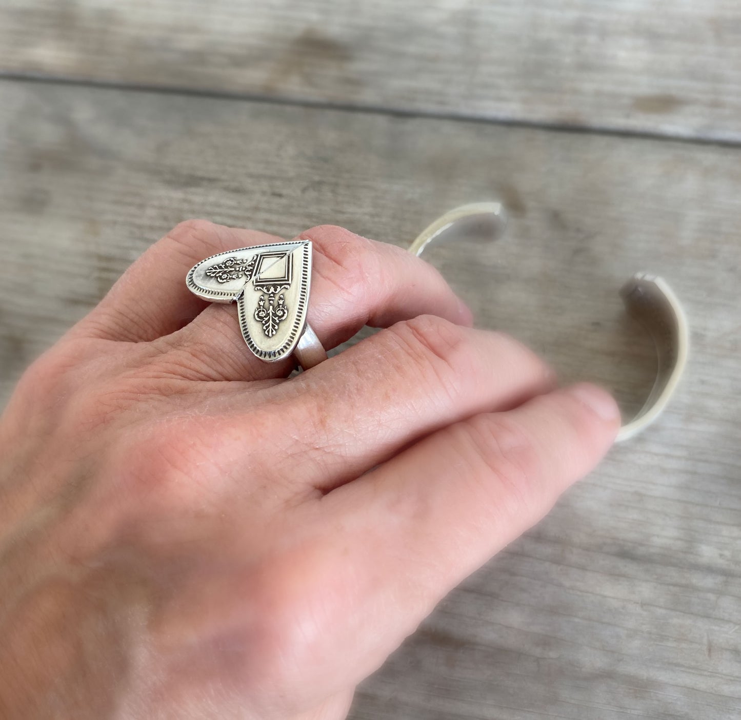 Grosvenor heart ring shown on hand - whimsical handcrafted upcycled silverware jewelry