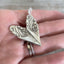 Back Side view of handmade heart pendant from upcycled vintage silverware