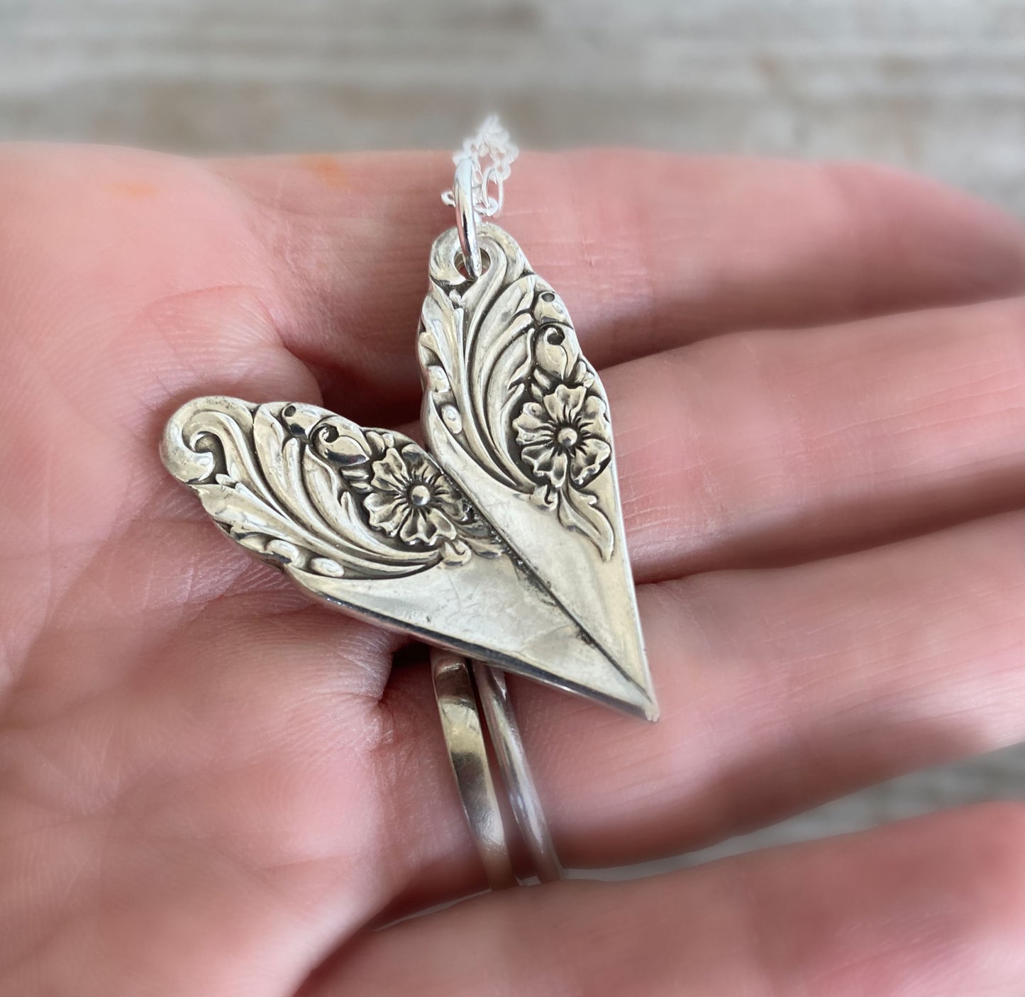 Back Side view of handmade heart pendant from upcycled vintage silverware