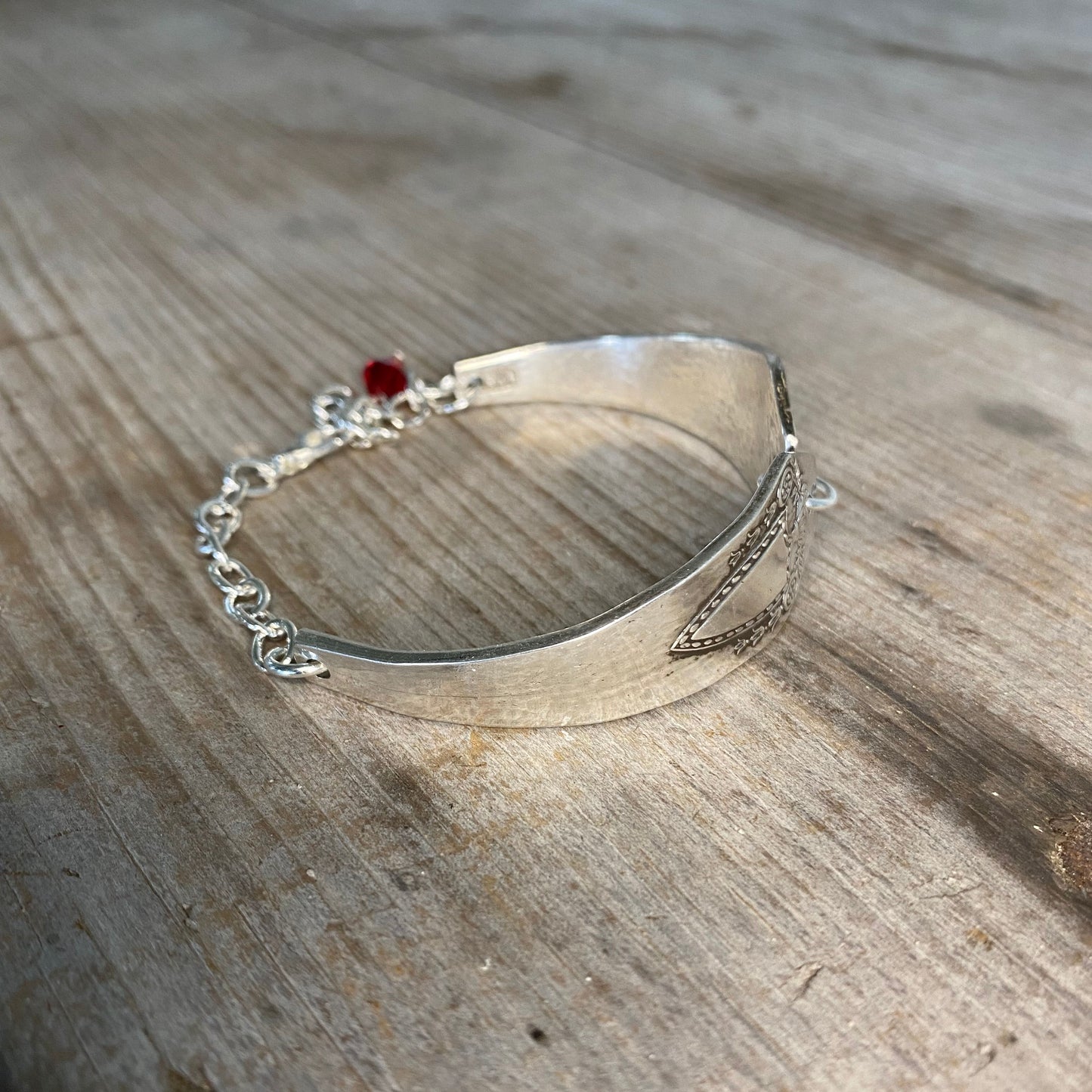 Detailed view of Heraldic spoon link bracelet showing vintage silverware pattern - eco-friendly upcycled artisan jewelry