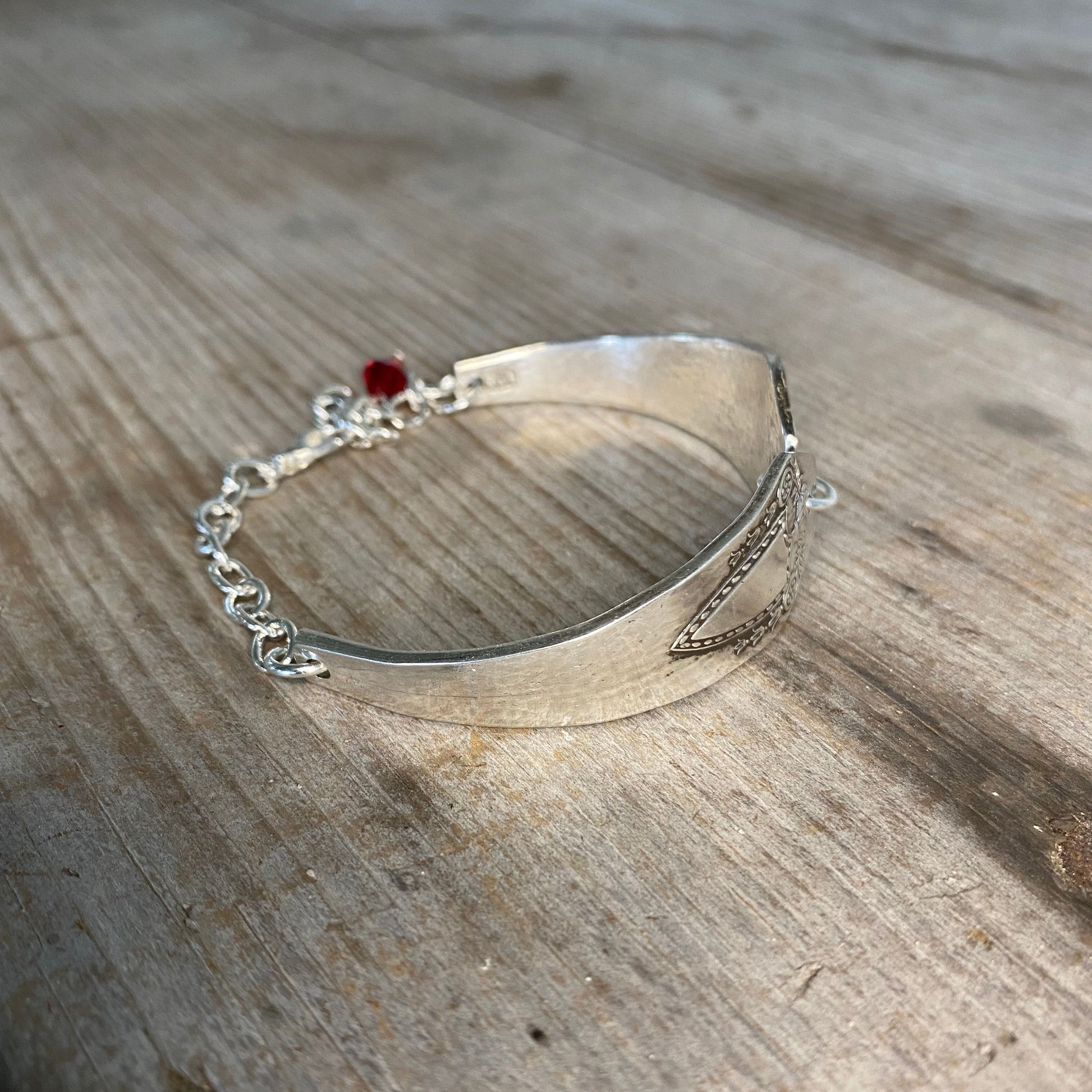 Detailed view of Heraldic spoon link bracelet showing vintage silverware pattern - eco-friendly upcycled artisan jewelry