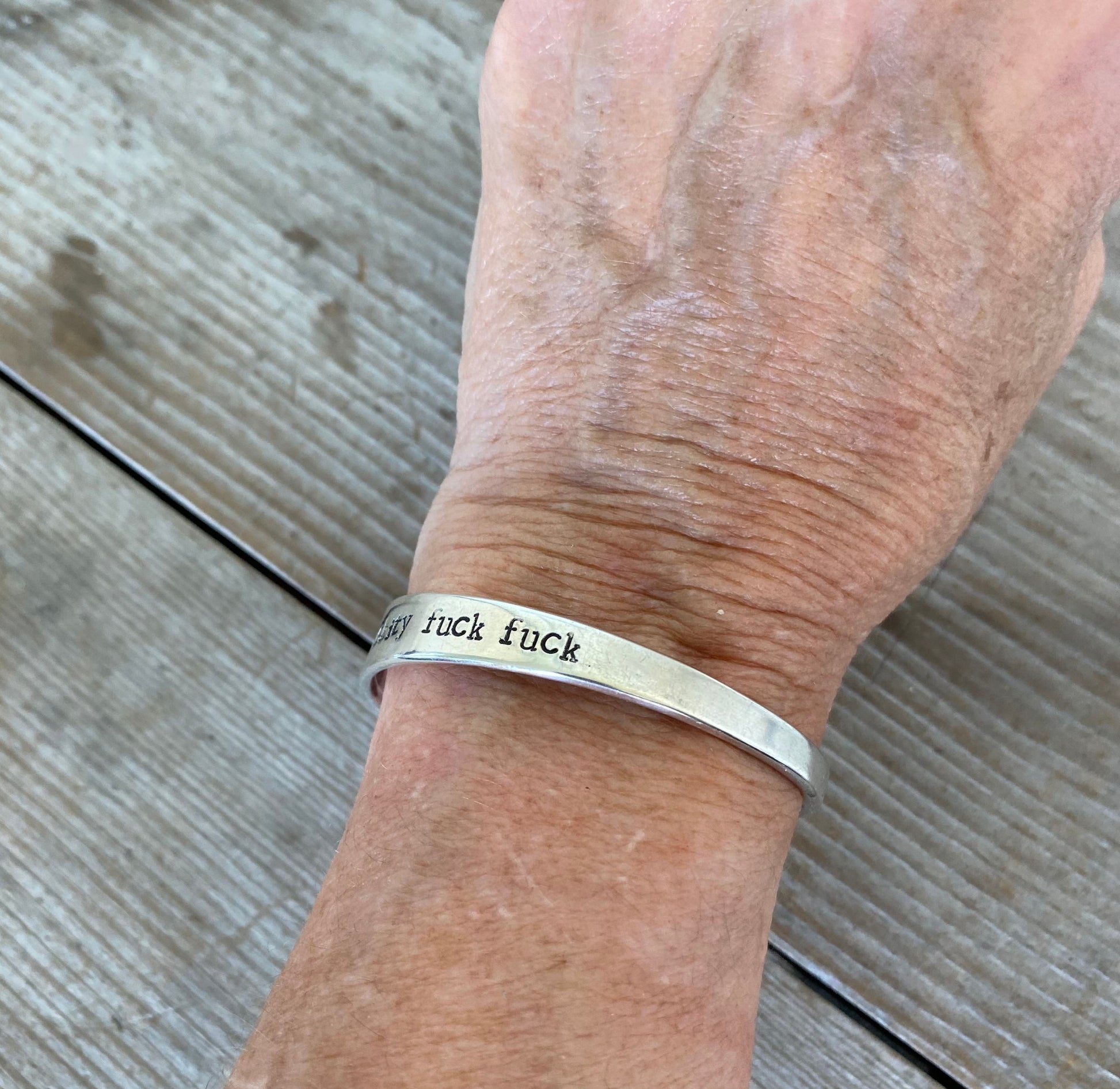 Hand Stamped Upcycled Spoon Cuff Bracelet FUCKITY FUCK FUCk Shown on Human Wrist