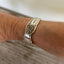 FAITH hand-stamped spoon cuff bracelet shown on model wrist - vintage 1950 Old Company Plate silverplate with inspirational message