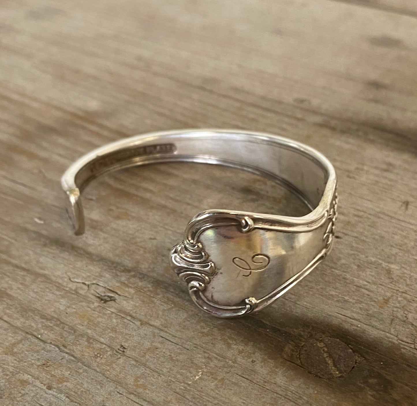 Close-up detail of original monogram on FAITH hand-stamped spoon cuff bracelet 