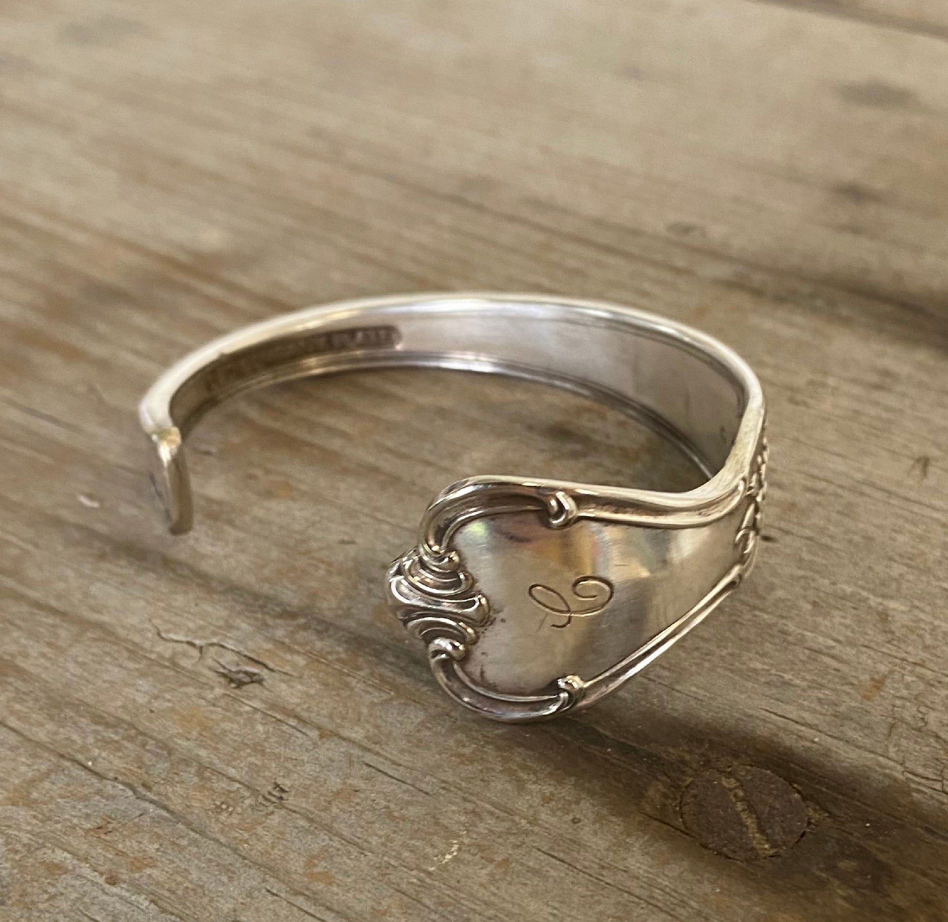 Close-up detail of original monogram on FAITH hand-stamped spoon cuff bracelet 