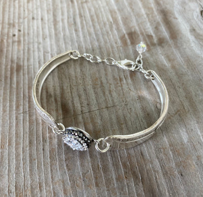 Top view of eco-friendly Camelia pattern spoon bracelet with druzy bead - handmade upcycled vintage silverware jewelry