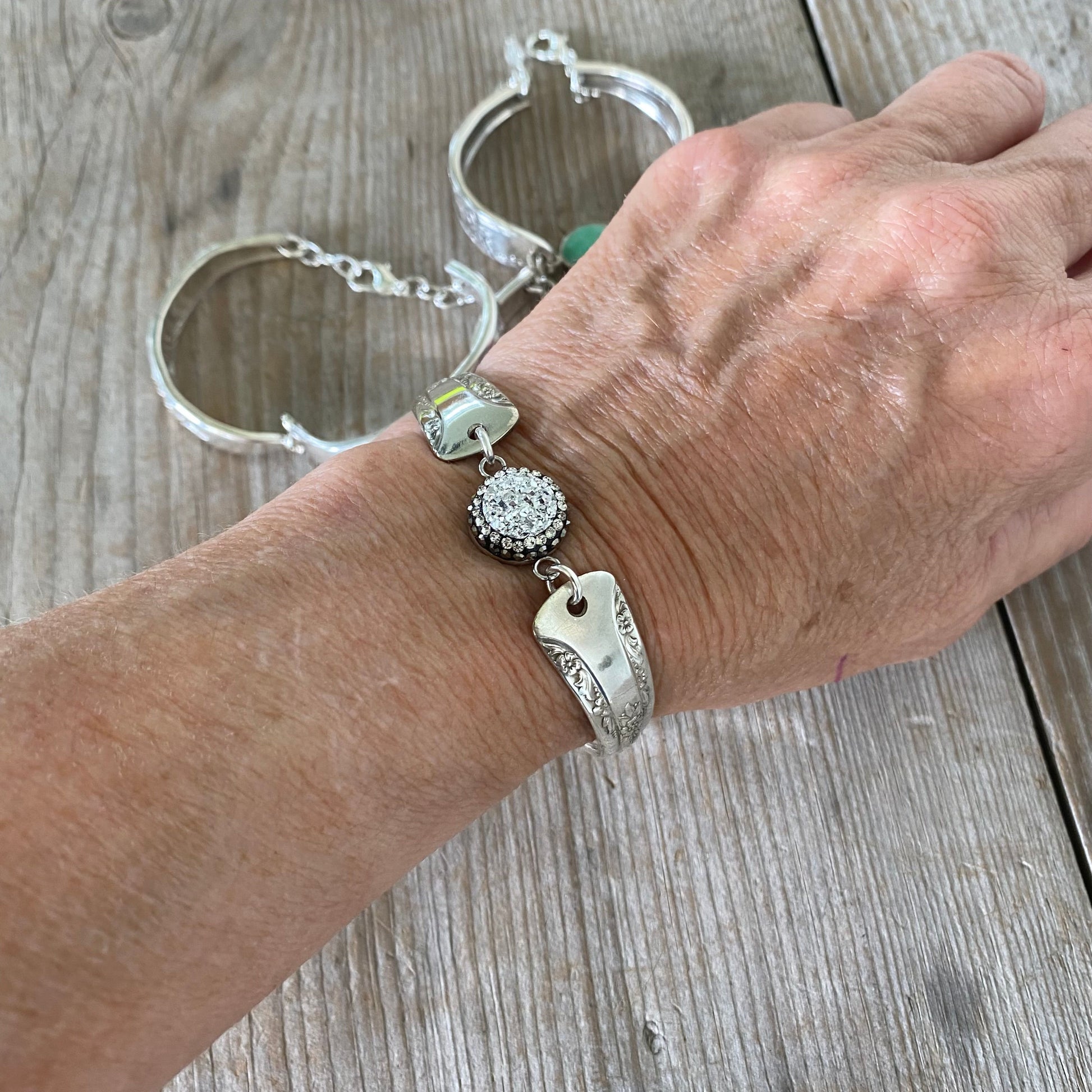 Camelia spoon link bracelet with druzy bead modeled on wrist - handcrafted upcycled vintage silverware 