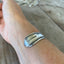 REMEMBER hand-stamped spoon cuff bracelet shown on model wrist - vintage 1932 William A. Rogers silverplate with meaningful message