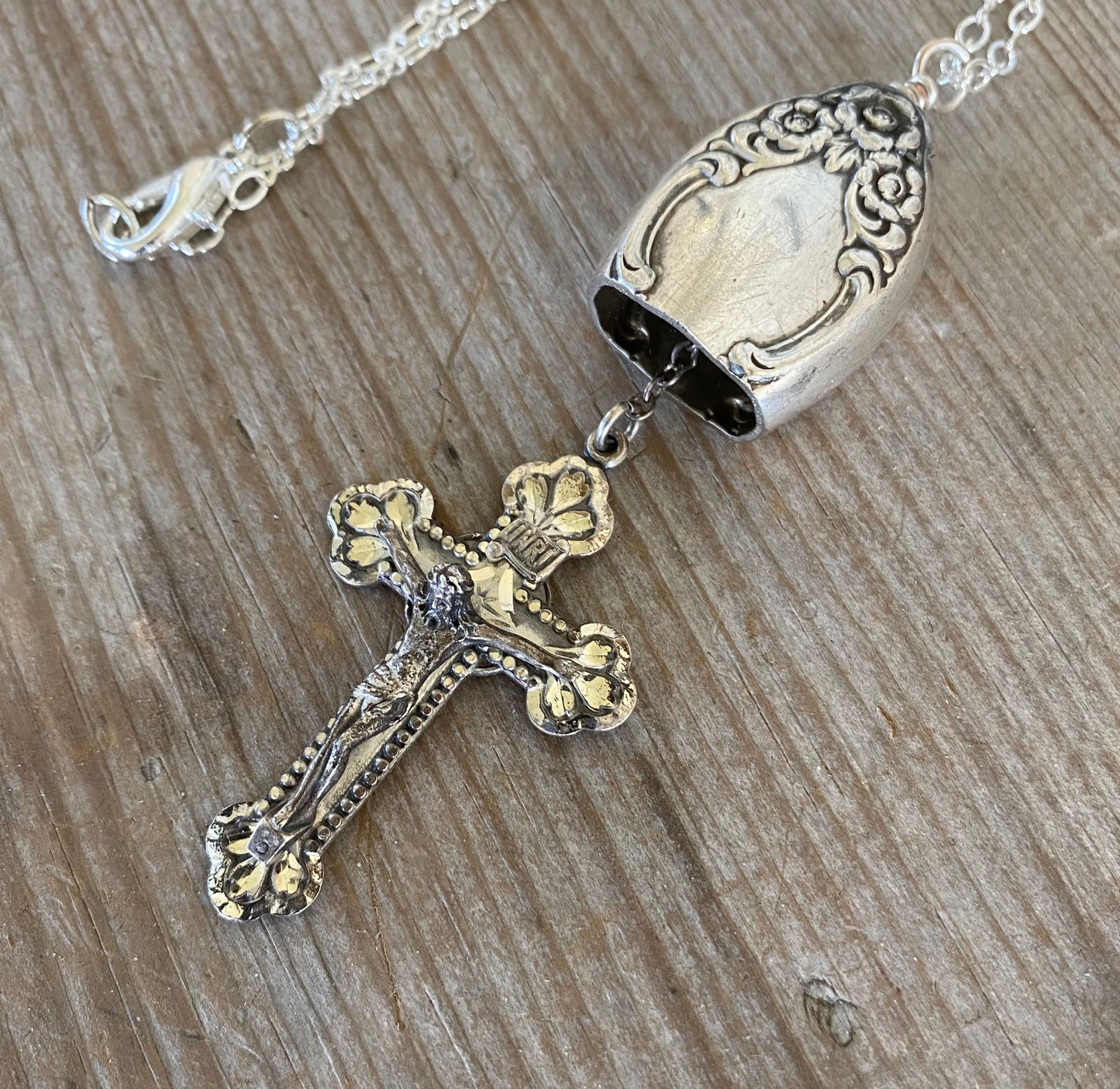 Vintage sterling silver rosary cross hanging as clapper inside upcycled knife bell pendant