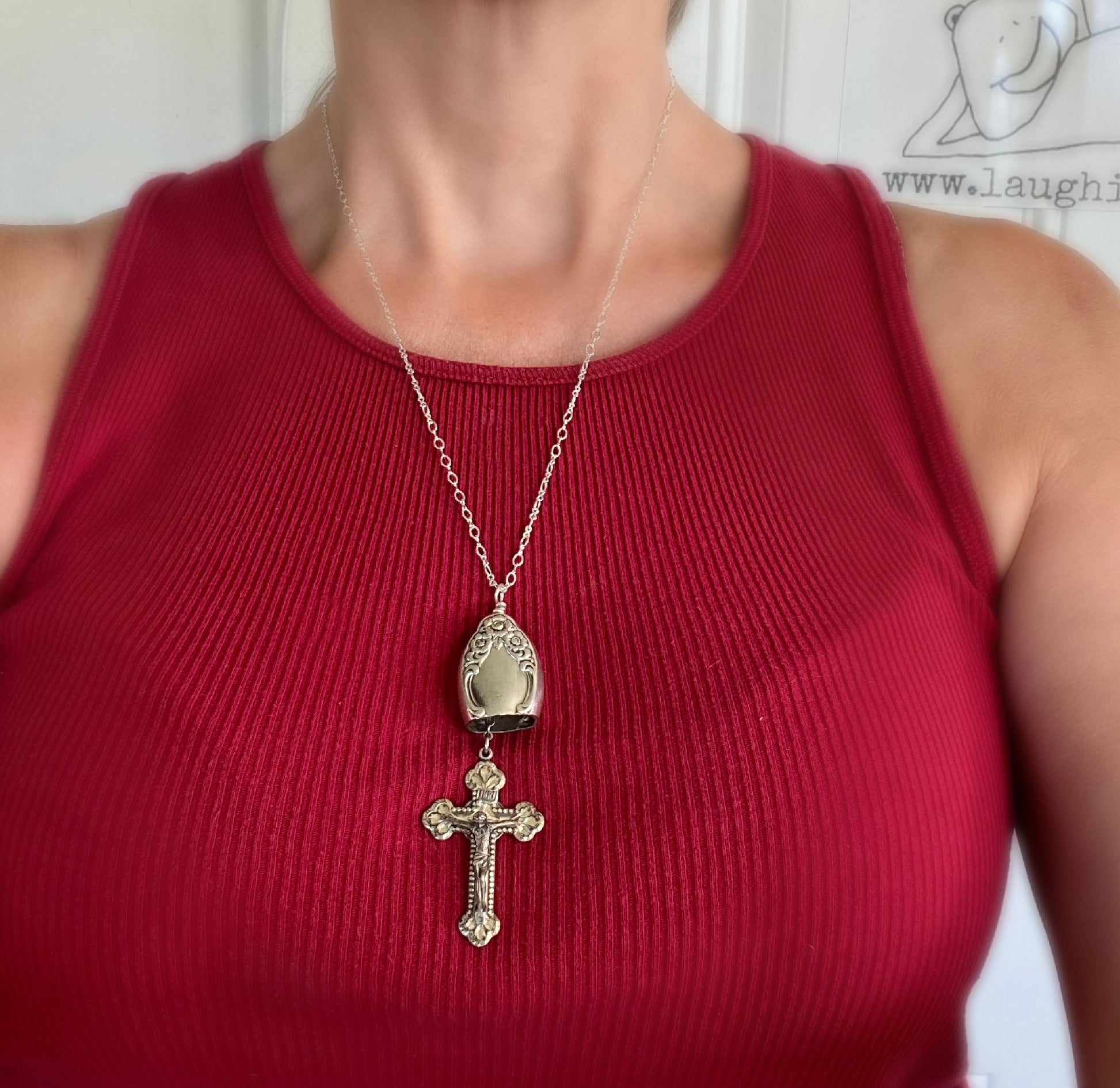 Knife bell necklace with rosary cross shown on model - handcrafted upcycled vintage silverware jewelry