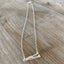 Handcrafted VOTE bar necklace hand-stamped on upcycled vintage silverplate with typewriter-style font, eco-friendly jewelry