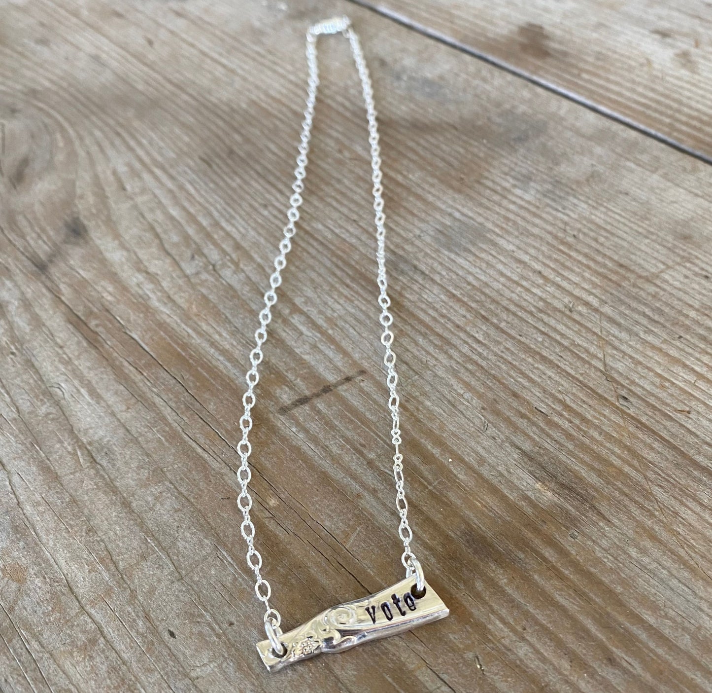 Handcrafted VOTE bar necklace hand-stamped on upcycled vintage silverplate with typewriter-style font, eco-friendly jewelry