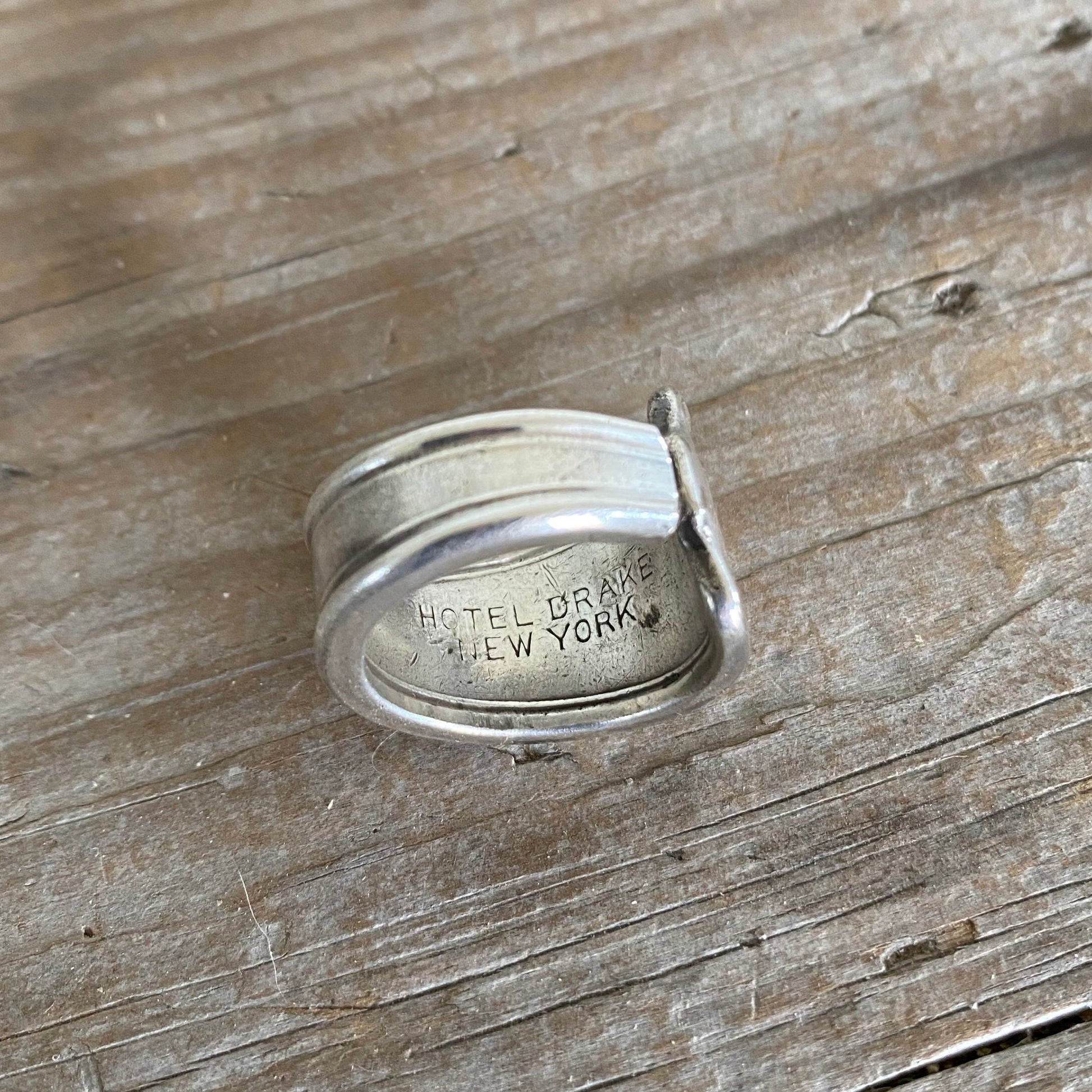 Inside of the Handmade Spoon Ring from hotel silver from The Drake Hotel New York indicating its from The Drake