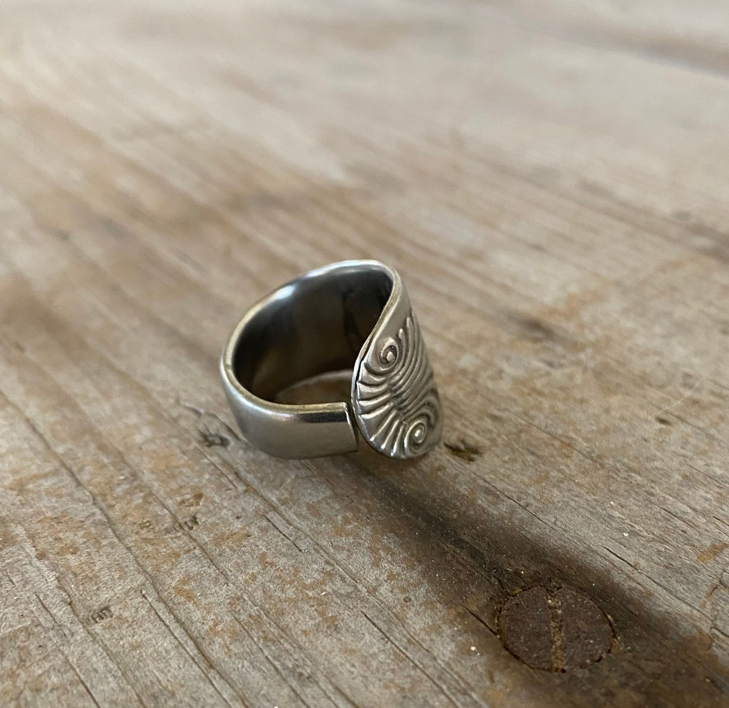 Close-up of SHELL pattern spoon ring showing ornate vintage silverware detail