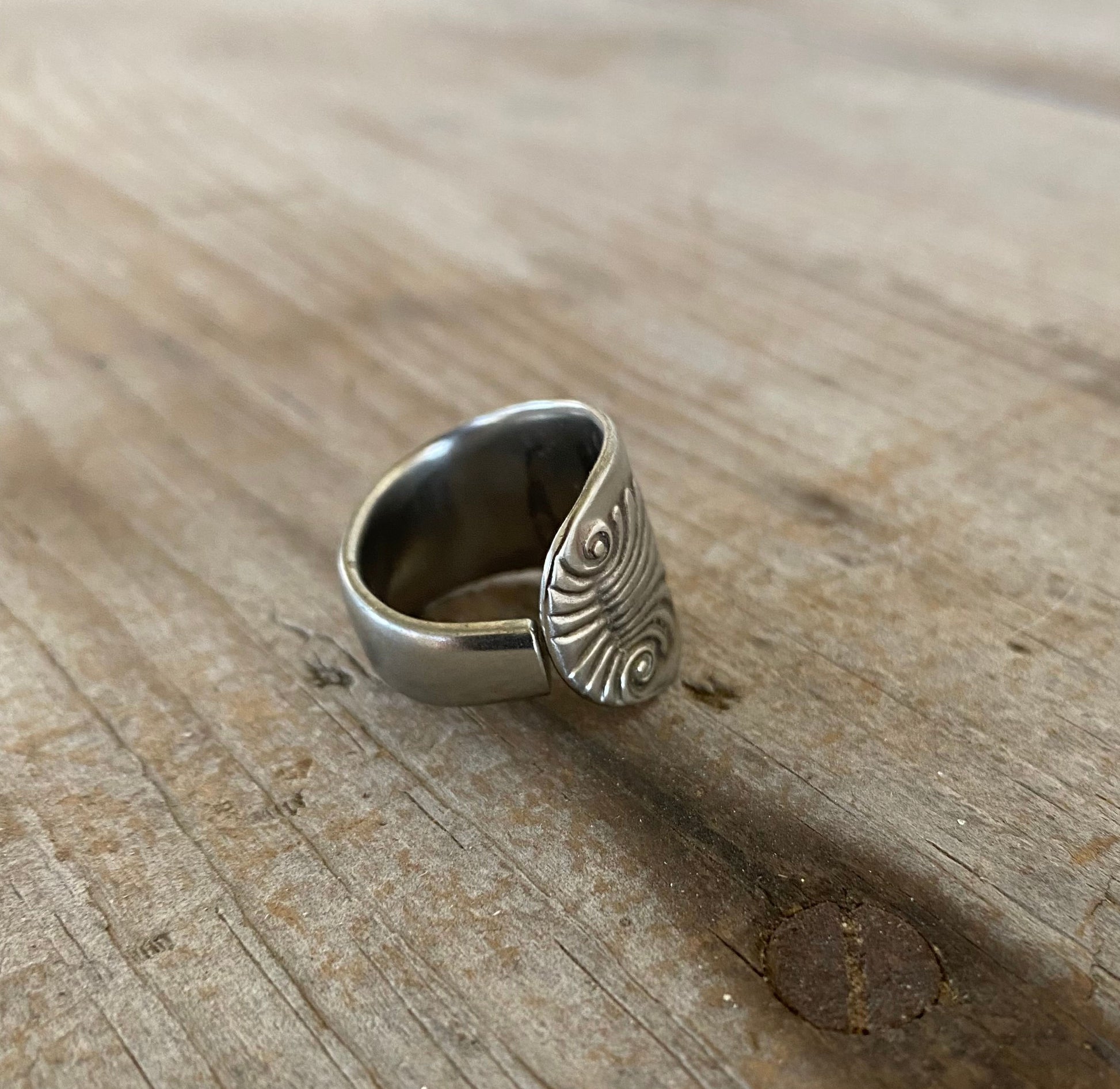 Close-up of SHELL pattern spoon ring showing ornate vintage silverware detail