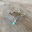 Close-up detail of 1913 Fairfield spoon links with jadeite bead and rhinestone spacer - handcrafted artisan silverware bracelet
