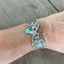 Fairfield spoon link bracelet with jadeite bead modeled on wrist - handcrafted upcycled 1913 vintage silverware jewelry