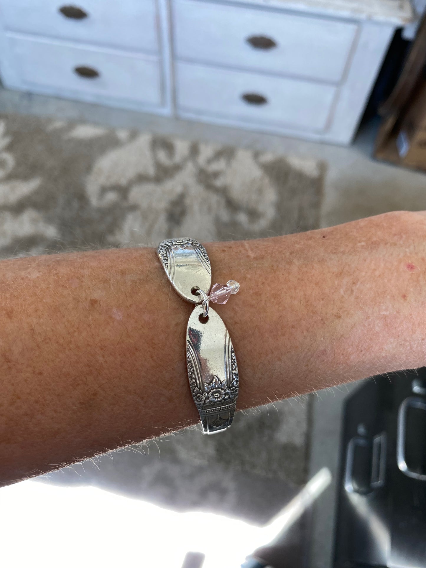 FIRST LOVE spoon link bracelet worn on wrist displaying size and fit