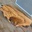 Italian olivewood charcuterie board with rustic bark edge and rope handle - handcrafted from 150-year-old wood